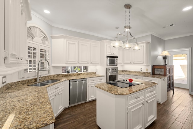 16022 Winchmore Hill Dr, Spring, TX 77379 - kitchen featuring stainless steel appliances, a sink, a center island, dark wood finished floors, and white cabinets