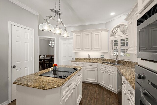 16022 Winchmore Hill Dr, Spring, TX 77379 - kitchen with a sink, stainless steel appliances, white cabinetry, ornamental molding, and recessed lighting