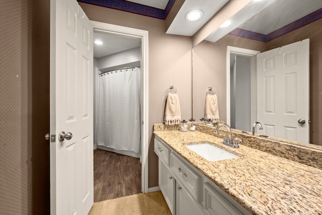 16022 Winchmore Hill Dr, Spring, TX 77379 - full bathroom featuring vanity, baseboards, wood finished floors, and recessed lighting