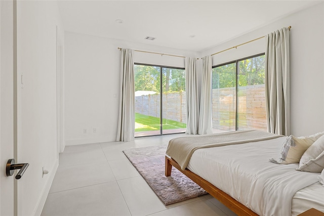 1550 Ashway St, Conroe, TX 77385 - tiled bedroom featuring access to exterior
