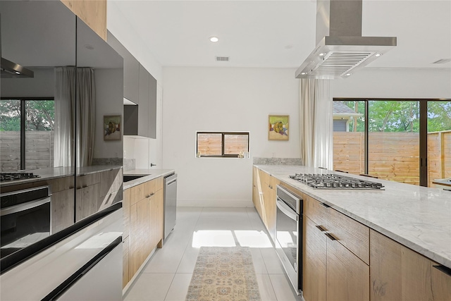 1550 Ashway St, Conroe, TX 77385 - kitchen featuring wall chimney range hood, stainless steel appliances, modern cabinets, healthy amount of natural light, and recessed lighting