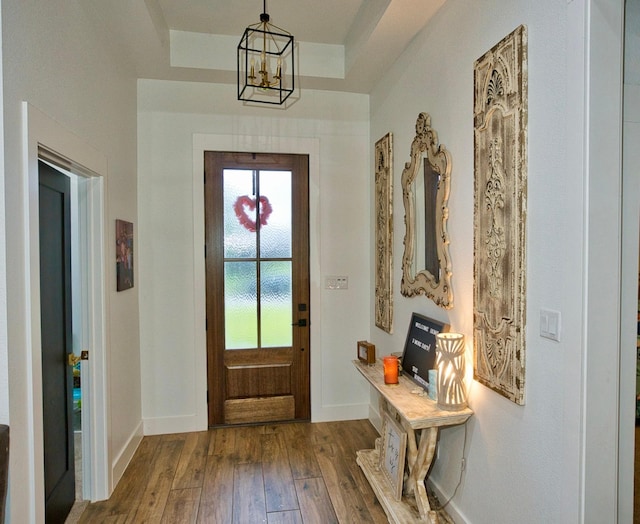 455 Green Meadows Dr, West Columbia, TX 77486 - foyer entrance featuring wood-type flooring, a chandelier, and baseboards