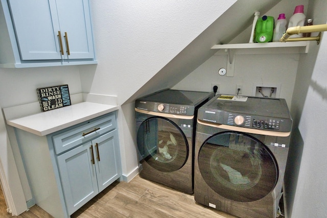 455 Green Meadows Dr, West Columbia, TX 77486 - washroom featuring separate washer and dryer, cabinet space, and light wood finished floors