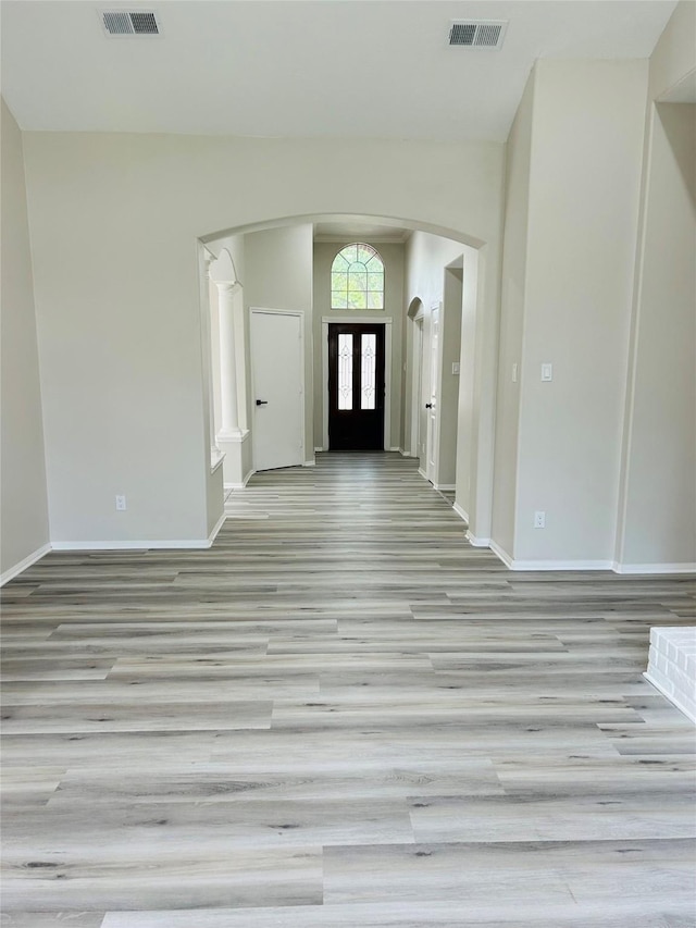 21227 River Knoll Ln, Katy, TX 77449 - foyer entrance with arched walkways, wood finished floors, and baseboards