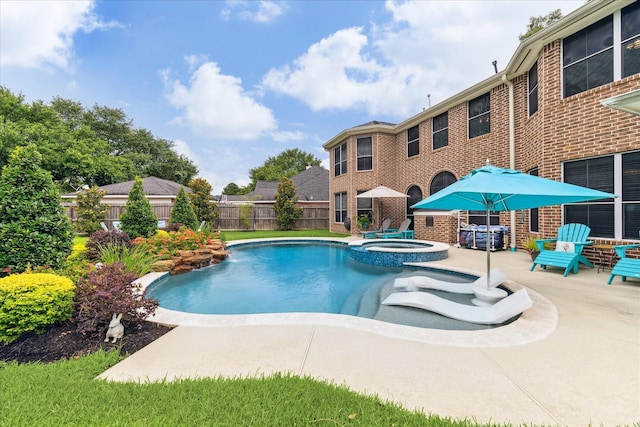 31415 Rigel Ct, Tomball, TX 77375 - view of swimming pool with a patio area and a pool with connected hot tub
