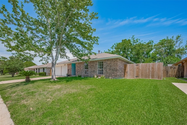 8411 Misty Vale Ln, Houston, TX 77075 - ranch-style house featuring an attached garage, brick siding, and concrete driveway
