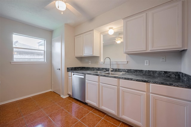 8411 Misty Vale Ln, Houston, TX 77075 - kitchen with dishwasher, ceiling fan, a sink, dark countertops, and baseboards