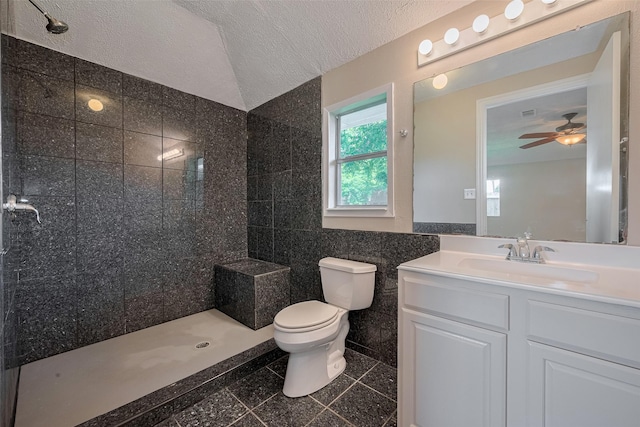 8411 Misty Vale Ln, Houston, TX 77075 - bathroom featuring granite floors, toilet, a tile shower, tile walls, and vanity