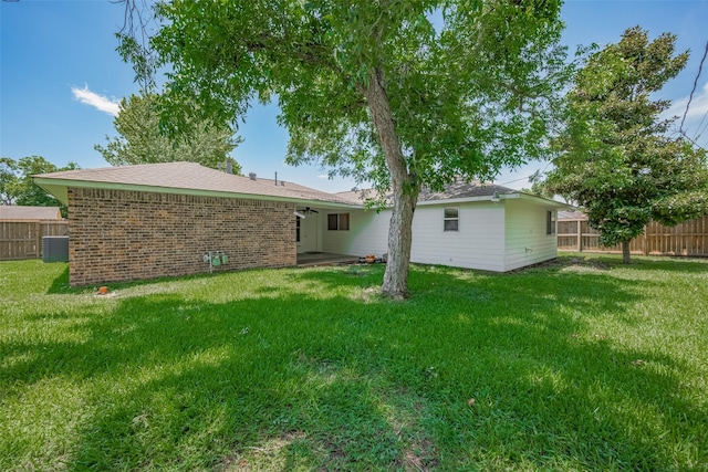 8411 Misty Vale Ln, Houston, TX 77075 - back of property featuring central AC