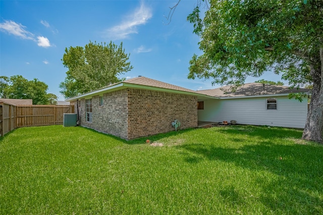 8411 Misty Vale Ln, Houston, TX 77075 - rear view of house featuring brick siding and central AC