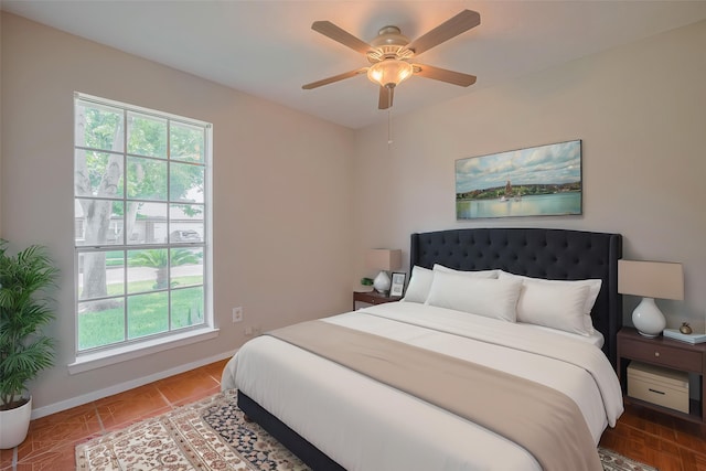 8411 Misty Vale Ln, Houston, TX 77075 - bedroom featuring baseboards and a ceiling fan