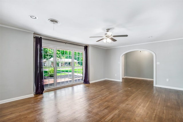 606 N Main St, Dayton, TX 77535 - spare room with a ceiling fan, ornamental molding, arched walkways, baseboards, and wood finished floors