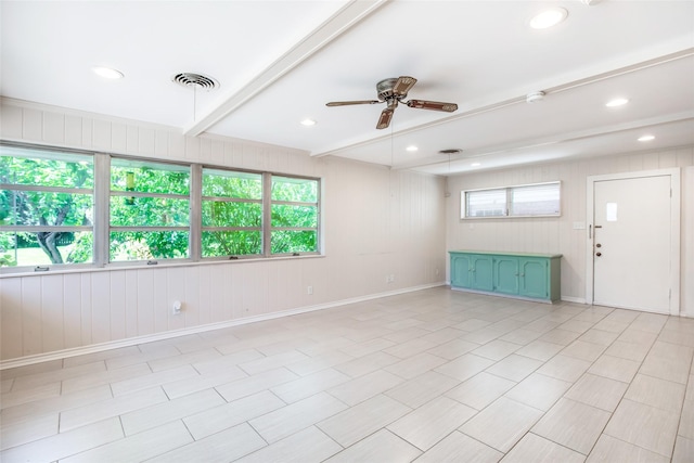 606 N Main St, Dayton, TX 77535 - spare room featuring ceiling fan, baseboards, beam ceiling, recessed lighting, and wooden walls