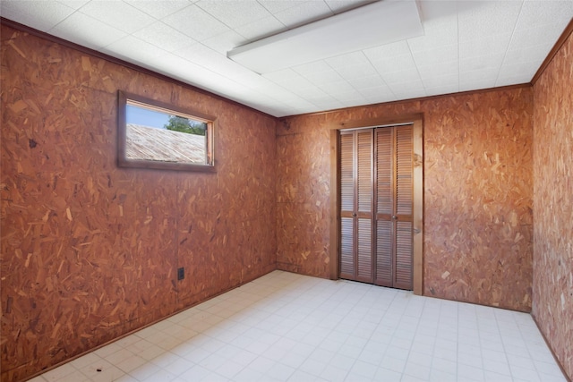 606 N Main St, Dayton, TX 77535 - empty room featuring wooden walls