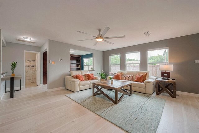 15251 Weeping Cedar Ln, Houston, TX 77084 - living area with baseboards, ceiling fan, and light wood-style floors
