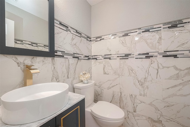 15251 Weeping Cedar Ln, Houston, TX 77084 - bathroom featuring vanity, tile walls, and toilet