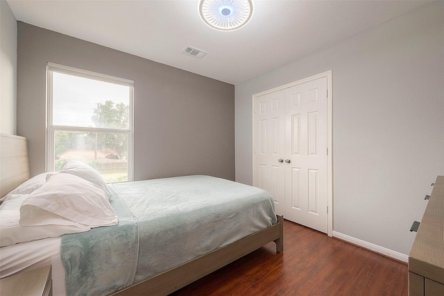 15251 Weeping Cedar Ln, Houston, TX 77084 - bedroom featuring wood finished floors, baseboards, and a closet
