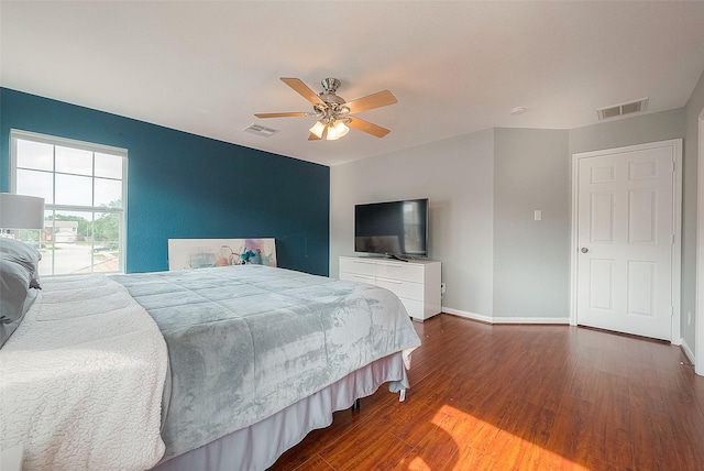 15251 Weeping Cedar Ln, Houston, TX 77084 - bedroom featuring wood finished floors, baseboards, and ceiling fan
