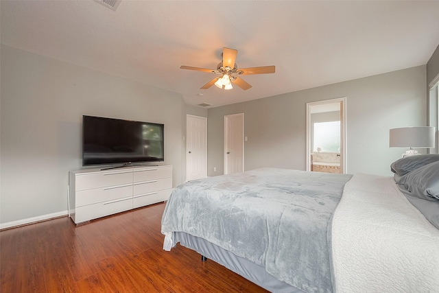 15251 Weeping Cedar Ln, Houston, TX 77084 - bedroom featuring wood finished floors, baseboards, ceiling fan, and ensuite bath