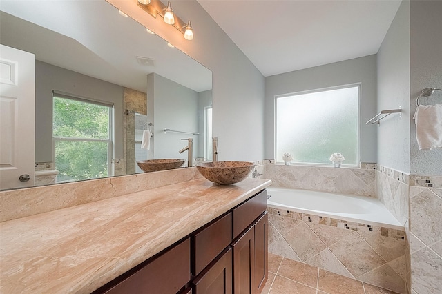 15251 Weeping Cedar Ln, Houston, TX 77084 - bathroom featuring a bath, vanity, a stall shower, and tile patterned floors