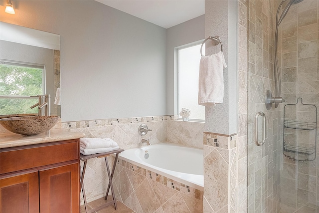 15251 Weeping Cedar Ln, Houston, TX 77084 - full bath featuring a stall shower, a garden tub, and vanity
