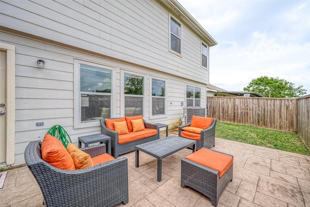 15251 Weeping Cedar Ln, Houston, TX 77084 - fenced backyard featuring an outdoor hangout area, a patio, and central air condition unit