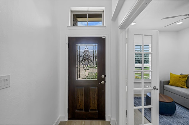 24203 Leonforte Dr, Richmond, TX 77406 - entrance foyer with plenty of natural light, wood finished floors, and baseboards