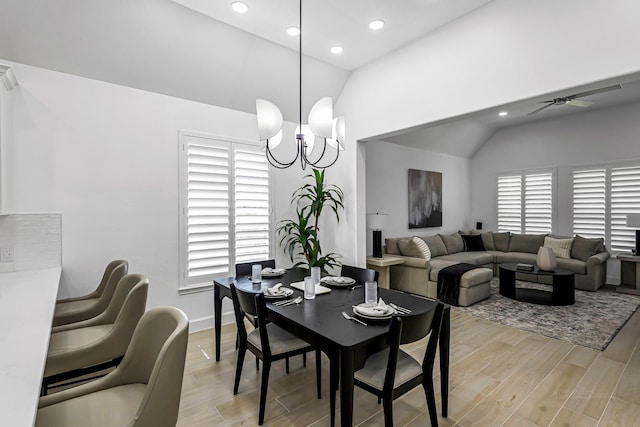 24203 Leonforte Dr, Richmond, TX 77406 - dining space with vaulted ceiling, recessed lighting, light wood-type flooring, a ceiling fan, and a chandelier
