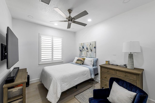 24203 Leonforte Dr, Richmond, TX 77406 - bedroom featuring baseboards, recessed lighting, a ceiling fan, and wood finished floors