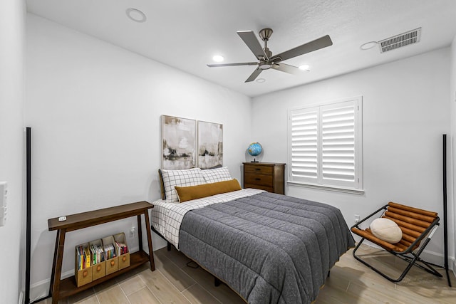 24203 Leonforte Dr, Richmond, TX 77406 - bedroom with wood finished floors, baseboards, recessed lighting, and ceiling fan