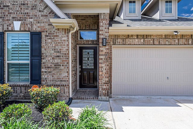 24203 Leonforte Dr, Richmond, TX 77406 - doorway to property featuring brick siding, driveway, and a garage