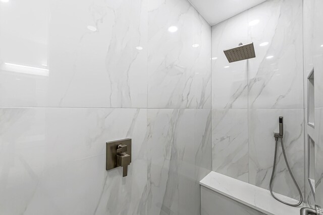24203 Leonforte Dr, Richmond, TX 77406 - bathroom featuring a marble finish shower