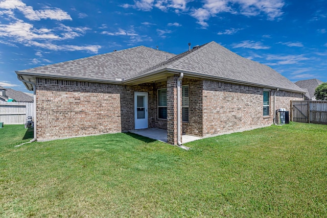 24203 Leonforte Dr, Richmond, TX 77406 - back of house featuring a shingled roof, brick siding, a patio, and a gate