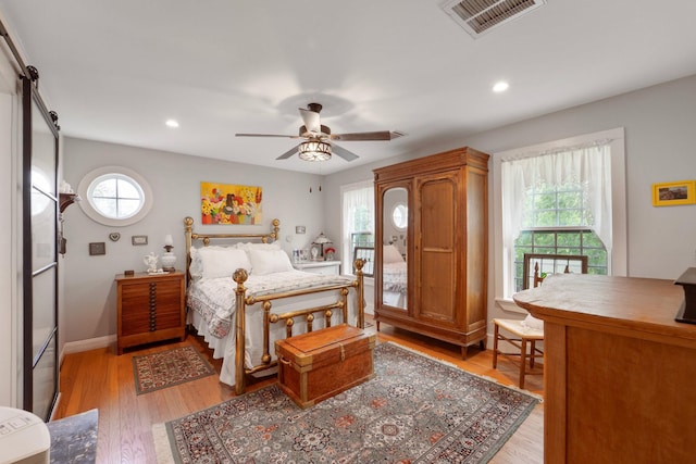 3222 Oakmont St, Houston, TX 77021 - bedroom featuring multiple windows, light wood-type flooring, recessed lighting, and baseboards
