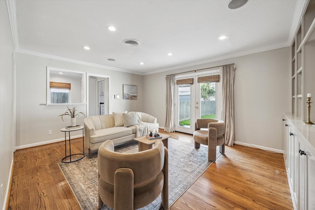 4634 Merwin St, Houston, TX 77027 - living room with ornamental molding, baseboards, light wood-style flooring, recessed lighting, and french doors