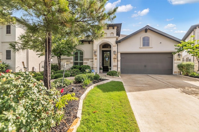 28249 Woodland Bend Way, Spring, TX 77386 - mediterranean / spanish-style home featuring stucco siding, driveway, a garage, and stone siding