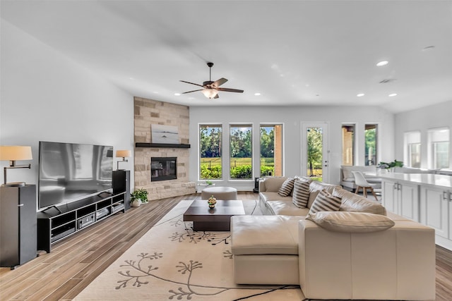 28249 Woodland Bend Way, Spring, TX 77386 - living area with recessed lighting, a ceiling fan, a fireplace, and light wood finished floors