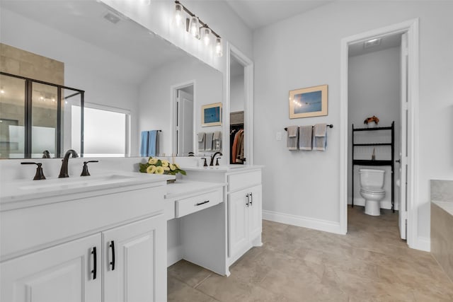 28249 Woodland Bend Way, Spring, TX 77386 - full bathroom featuring double vanity, a stall shower, toilet, baseboards, and lofted ceiling