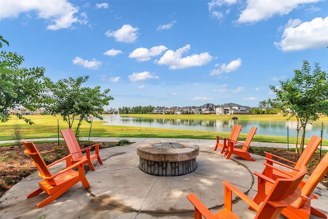 28249 Woodland Bend Way, Spring, TX 77386 - view of patio featuring a fire pit, a water view, and a residential view