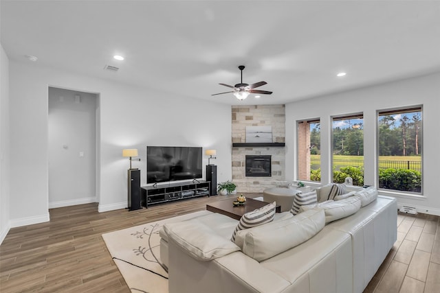 28249 Woodland Bend Way, Spring, TX 77386 - living area with a ceiling fan, wood finished floors, a fireplace, baseboards, and recessed lighting