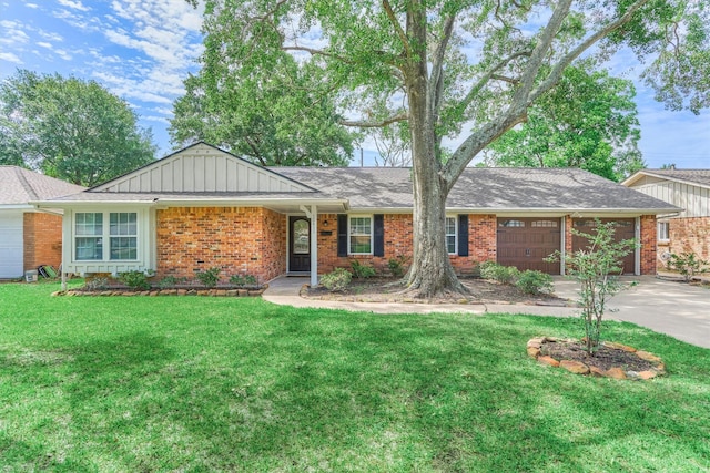 10411 Londonderry Dr, Houston, TX 77043 - ranch-style home featuring driveway, a garage, brick siding, a front yard, and board and batten siding