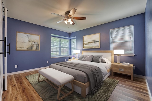 10411 Londonderry Dr, Houston, TX 77043 - bedroom with wood finished floors, baseboards, and a ceiling fan