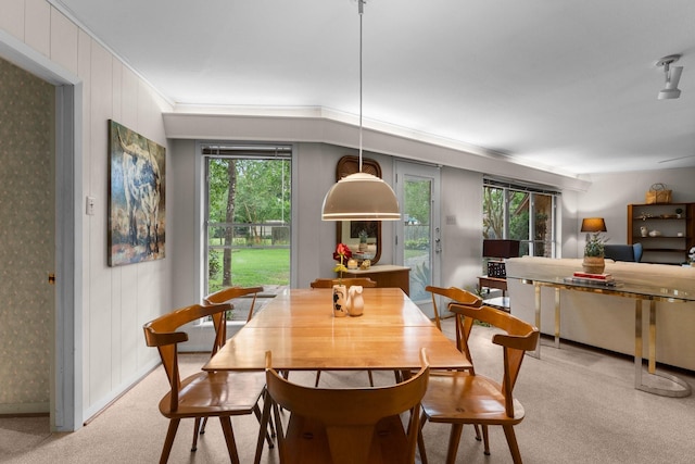 9809 Neuens Rd, Houston, TX 77080 - dining space with light carpet, plenty of natural light, and crown molding