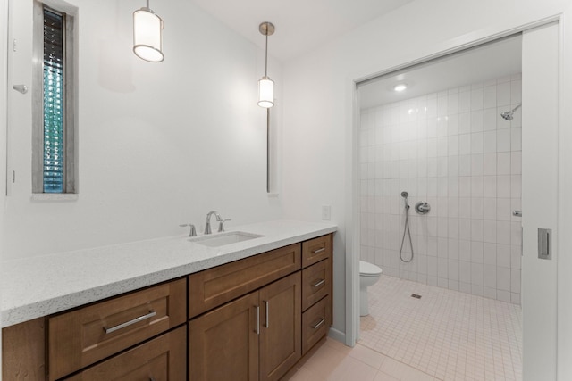 9809 Neuens Rd, Houston, TX 77080 - bathroom with toilet, vanity, a tile shower, and tile patterned flooring