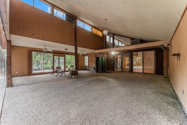 9809 Neuens Rd, Houston, TX 77080 - unfurnished living room with a ceiling fan, plenty of natural light, and a towering ceiling