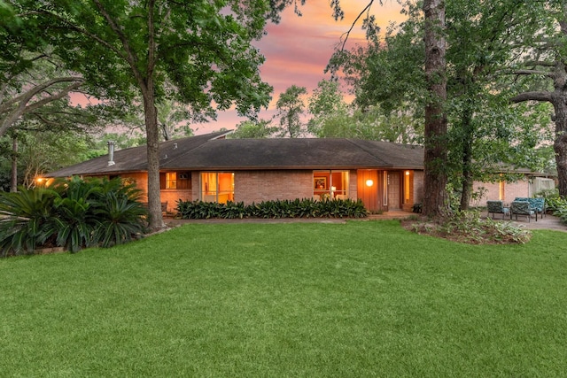9809 Neuens Rd, Houston, TX 77080 - view of front of house with a front yard and a patio area