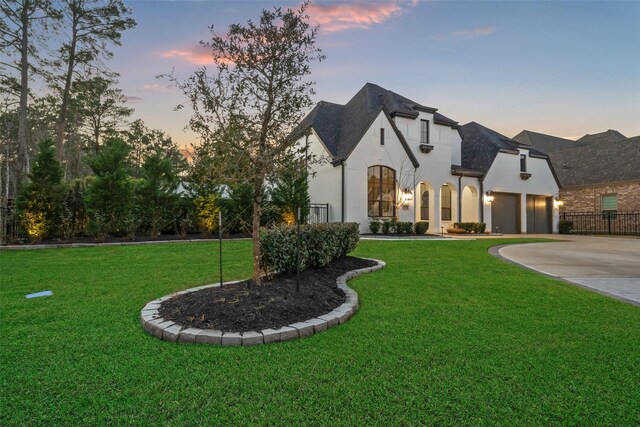 324 S Opulent Dr, Montgomery, TX 77316 - french provincial home featuring driveway, an attached garage, and stucco siding