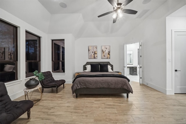324 S Opulent Dr, Montgomery, TX 77316 - bedroom featuring light wood-style floors, baseboards, lofted ceiling, ceiling fan, and connected bathroom