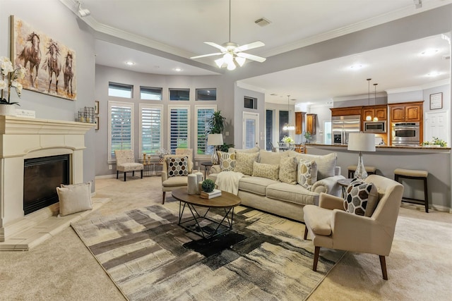 7014 Lake Haven Ct, Sugar Land, TX 77479 - living area with light colored carpet, recessed lighting, crown molding, a glass covered fireplace, and a ceiling fan