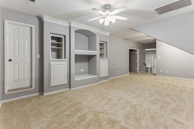 7014 Lake Haven Ct, Sugar Land, TX 77479 - unfurnished living room featuring a ceiling fan, carpet floors, baseboards, and built in features